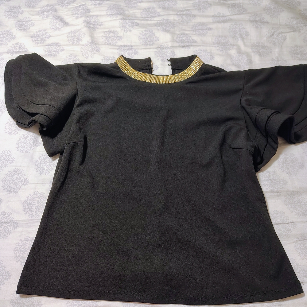 Elegant Black Top with Gold Accents